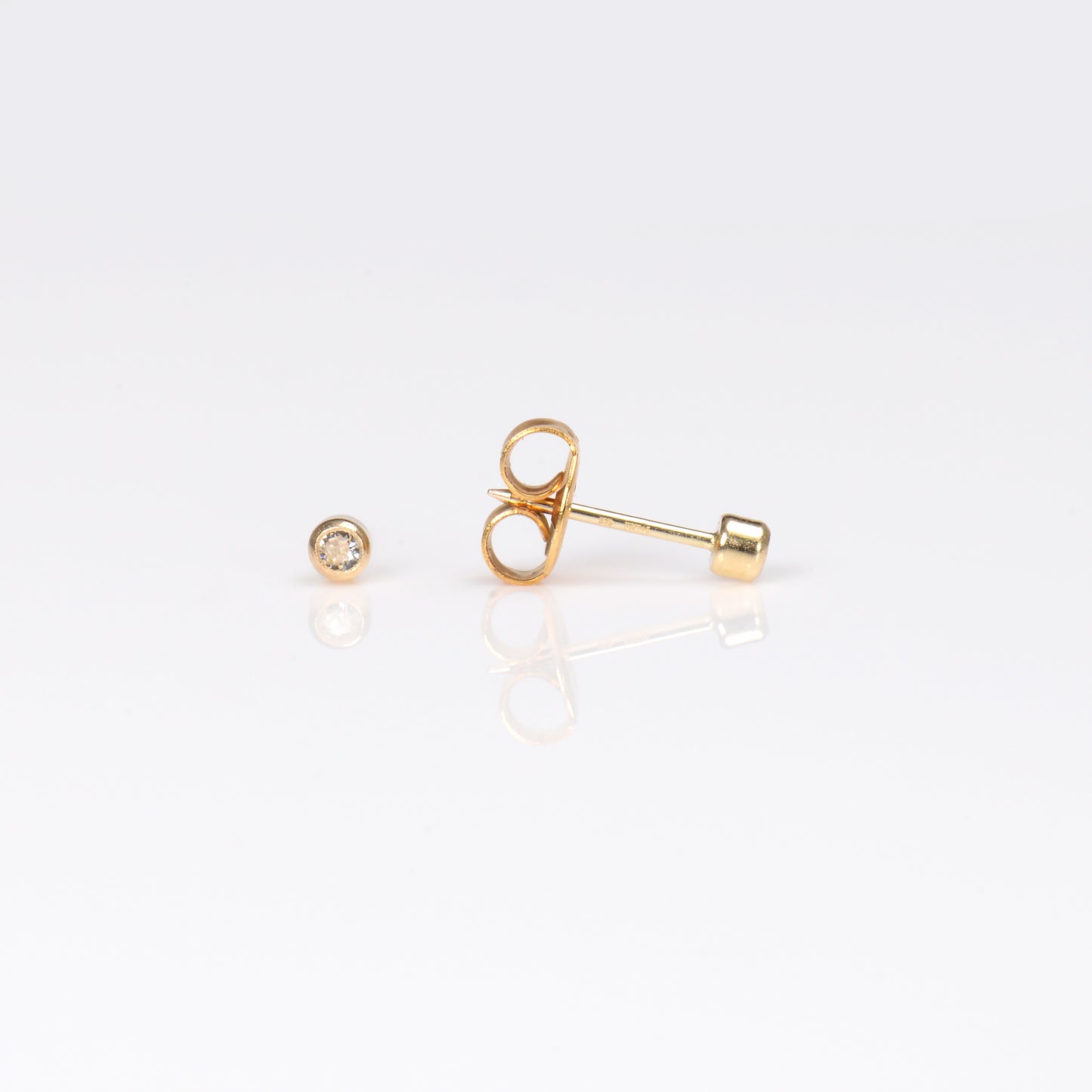 System 75™ Bezel Set Piercing Studs - 2mm - April Clear Crystal - 14K Yellow Gold