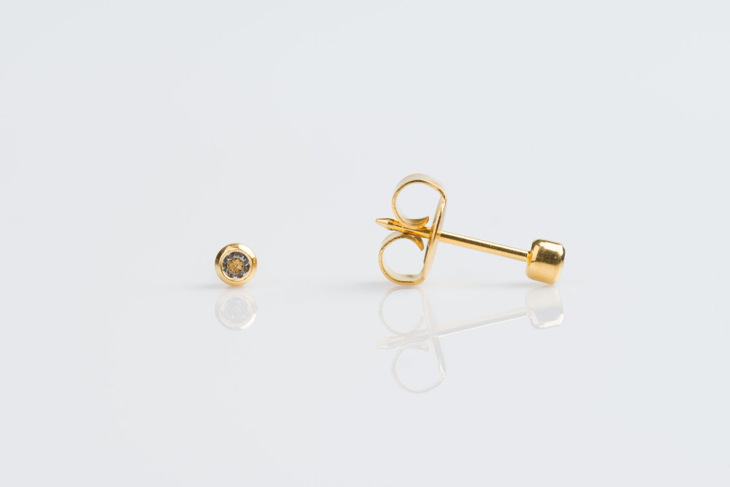 System 75™ Bezel Set Piercing Studs - 2mm - April Clear Crystal - Gold Plated